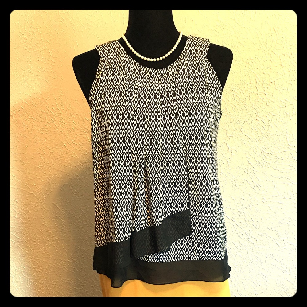 Medium black and white patterned dress shirt.